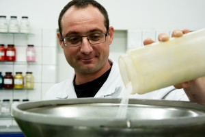 employee of Treffert mixing a pigment powder in the laboratory